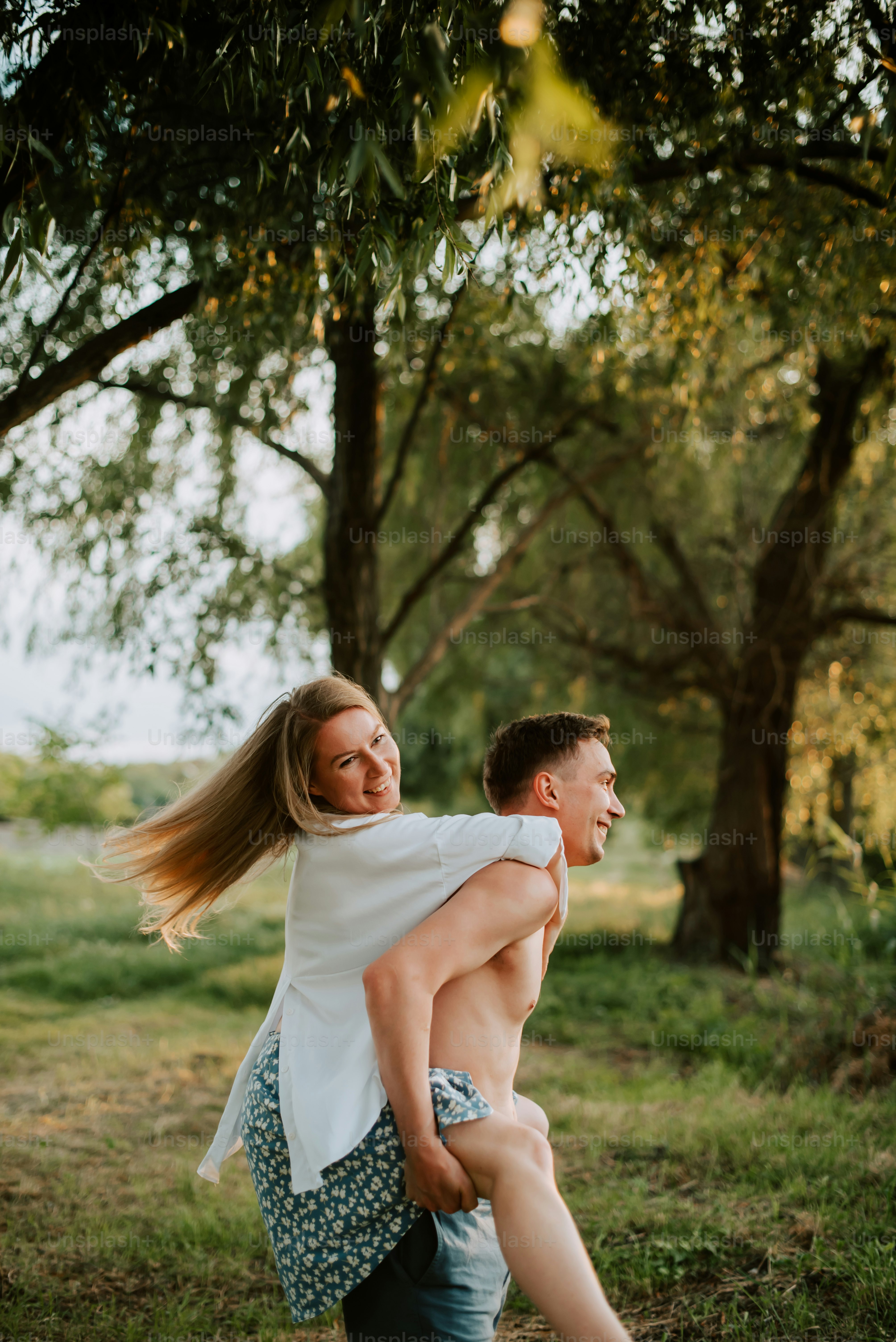 a man carrying a woman on his back