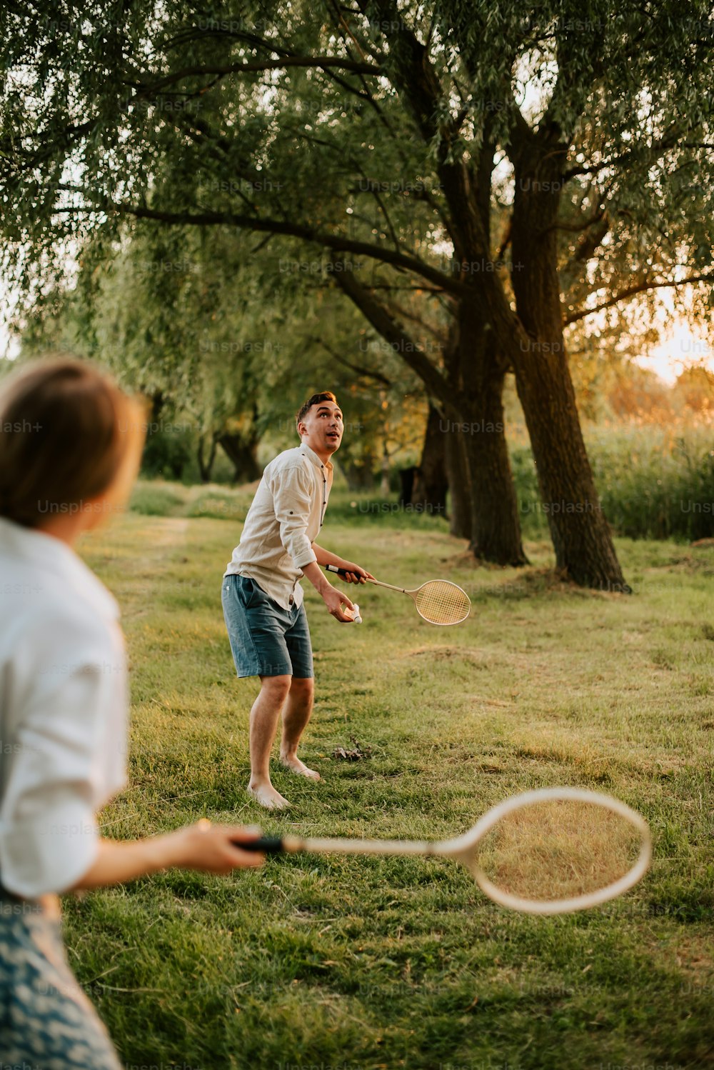 a couple of people that are playing with a frisbee