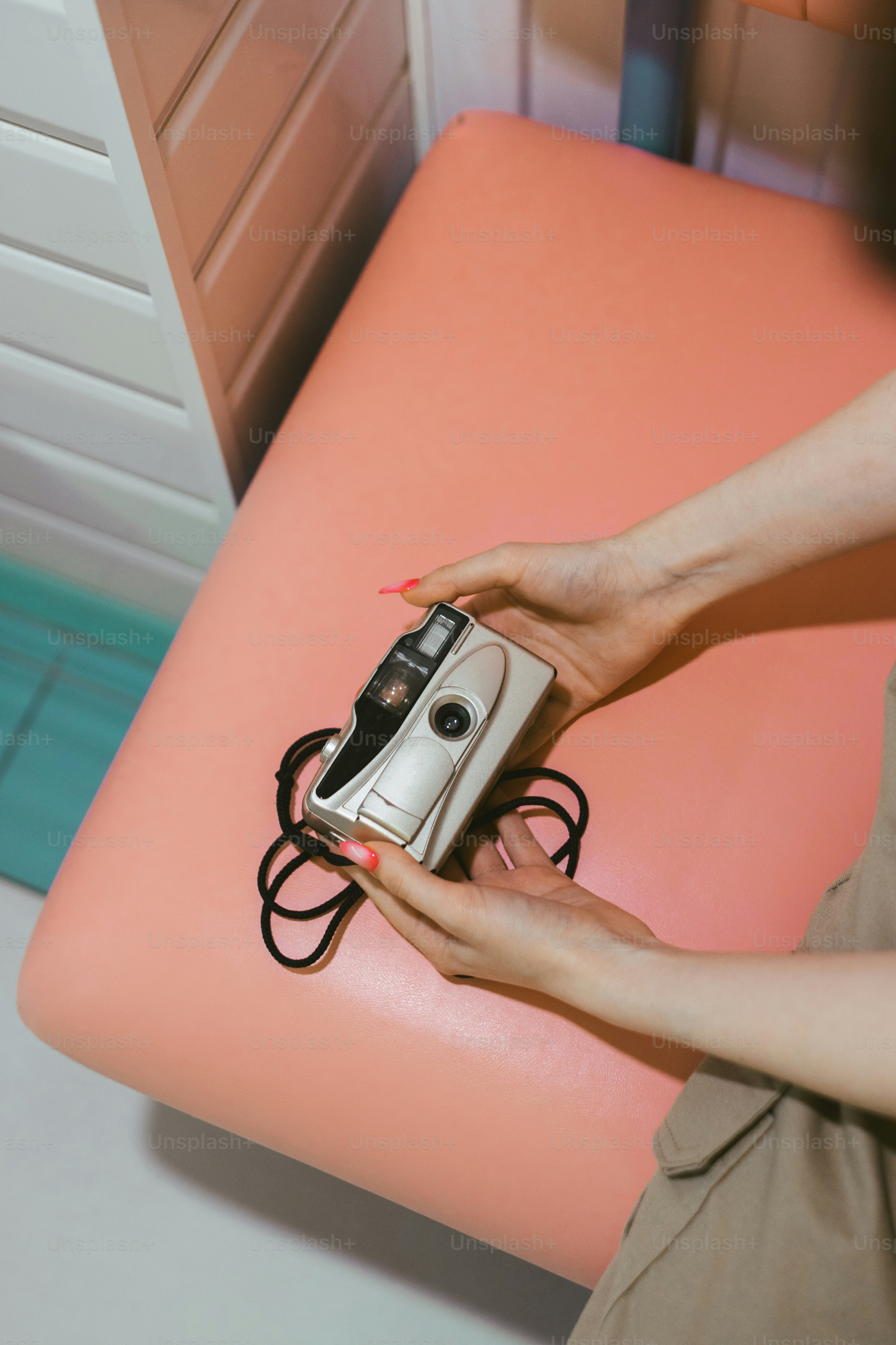 a woman holding a camera in her hand