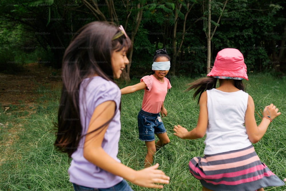 a group of young girls playing a game of frisbee