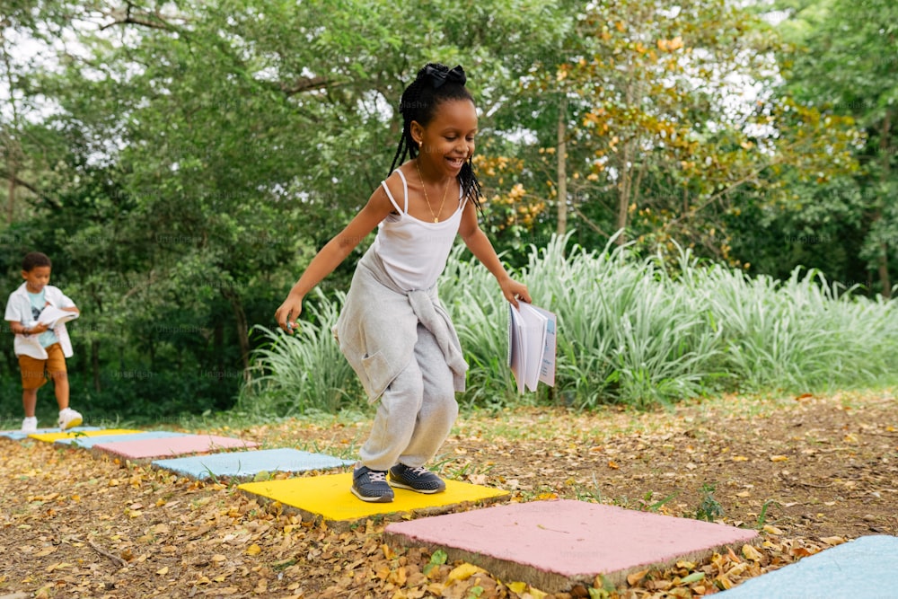 a young girl is playing with a frisbee