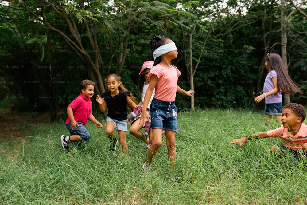 a group of children playing in a field