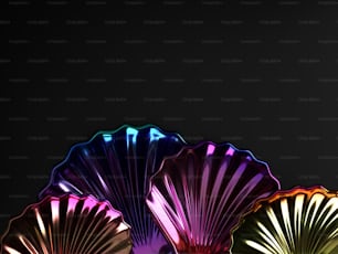 three different colored fan shaped lights on a black background