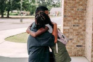 a man and a woman embracing each other