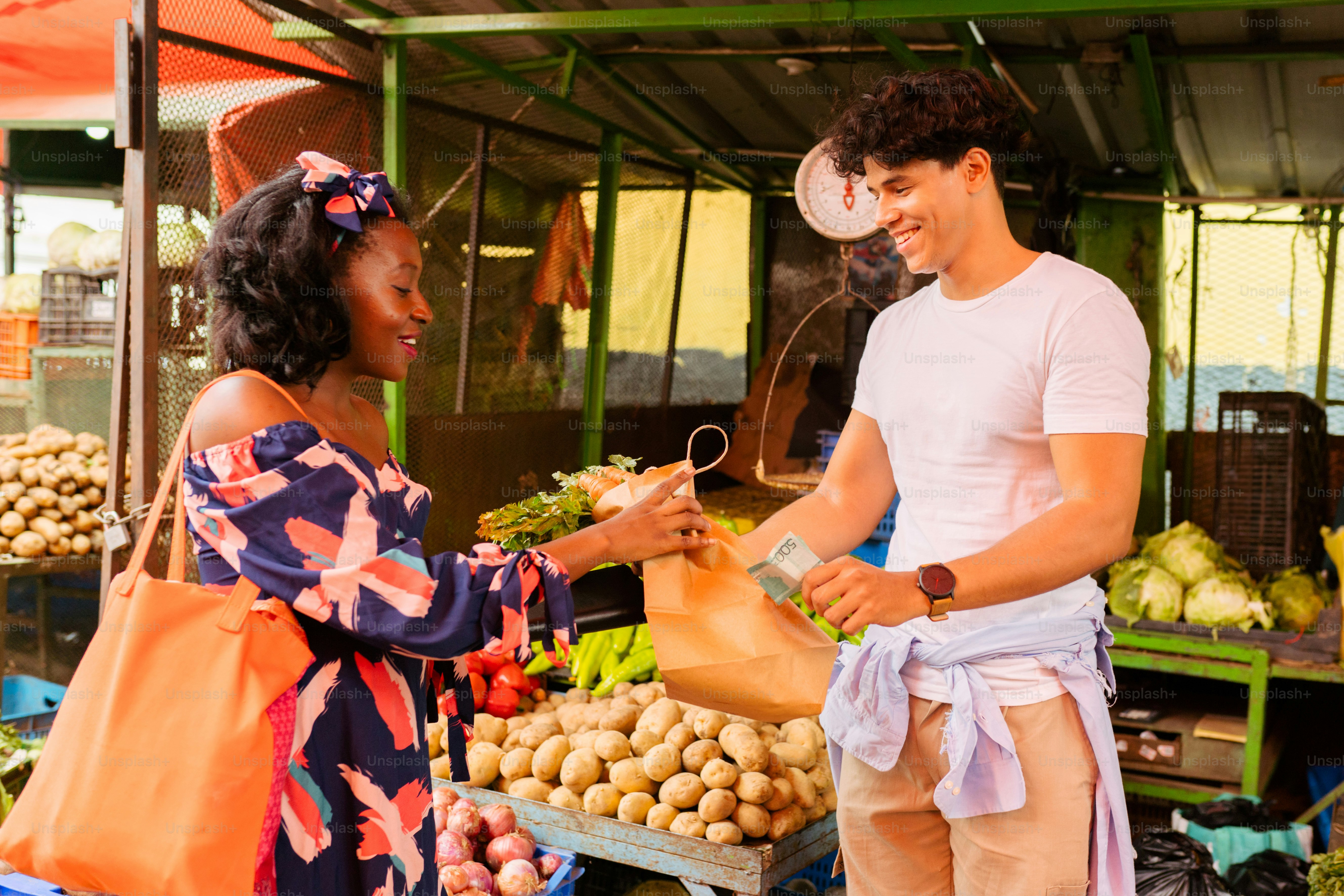 a man and woman standing in farmers market 