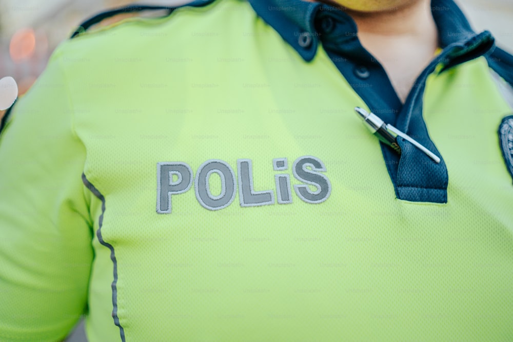 a police officer wearing a neon green shirt