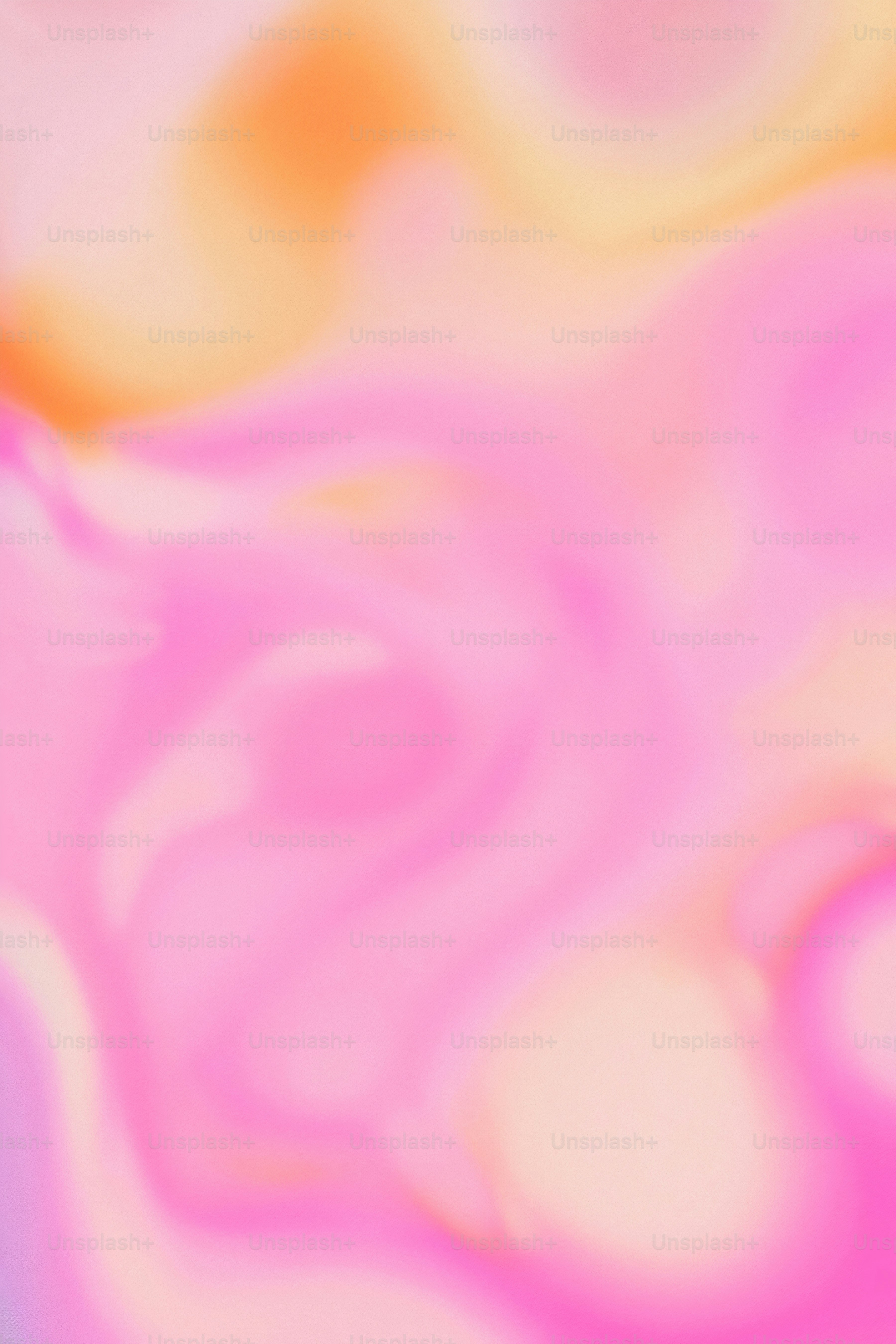 une image floue d’un arrière-plan rose et jaune