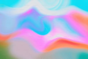 a blurry image of a blue, pink, and green background