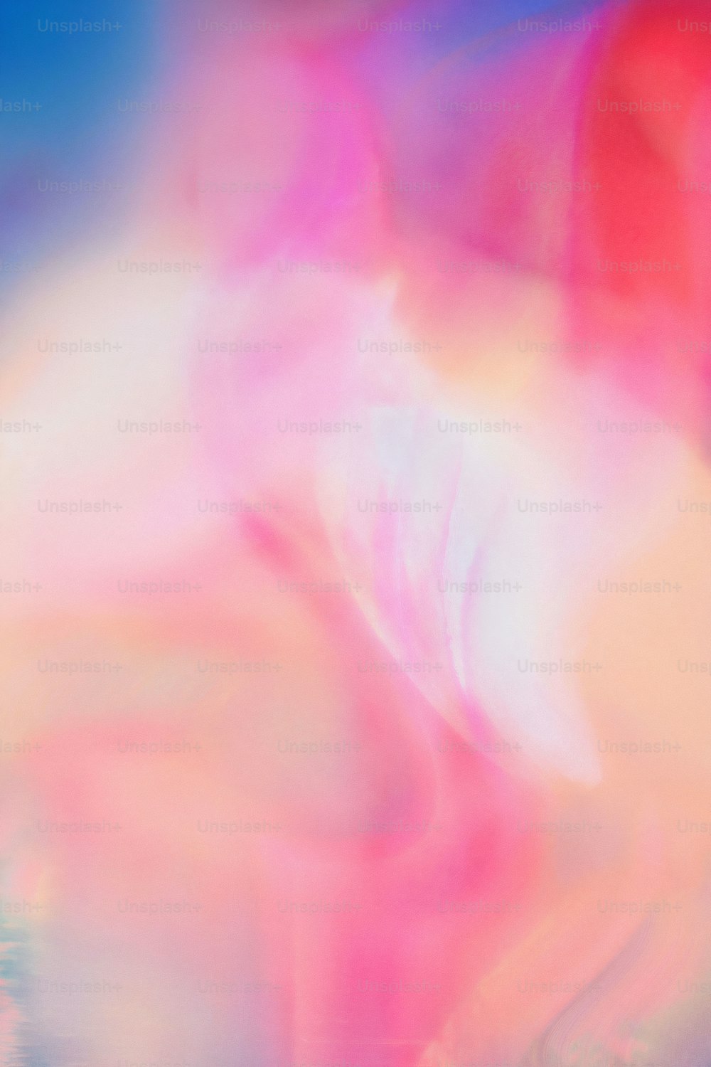 ein verschwommenes Bild eines rosa-blauen Hintergrunds