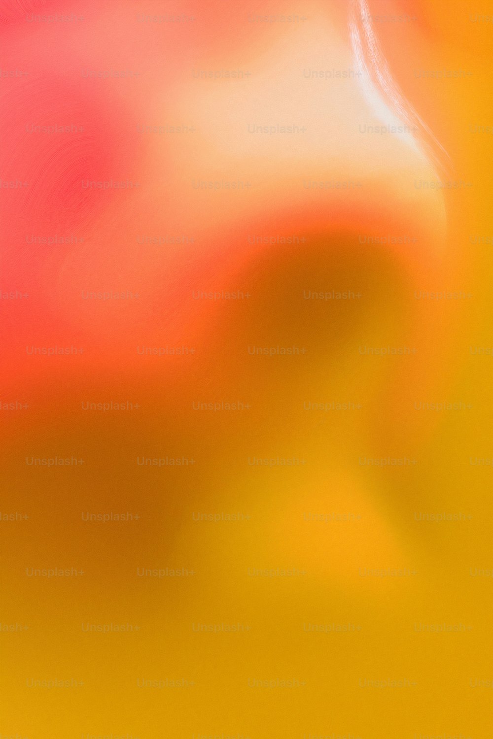 a blurry image of a red and yellow background