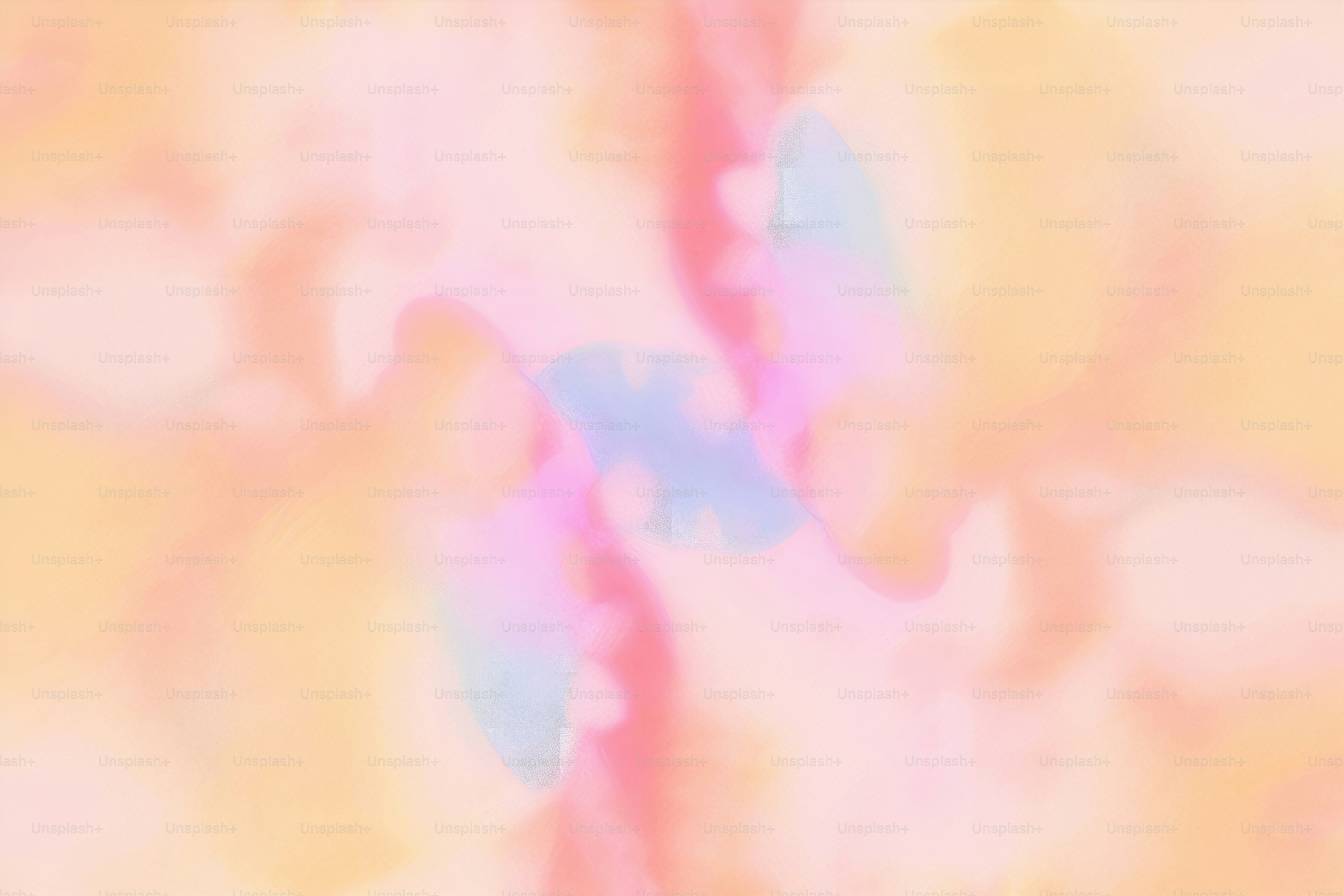 a blurry image of a pink, blue, and yellow background