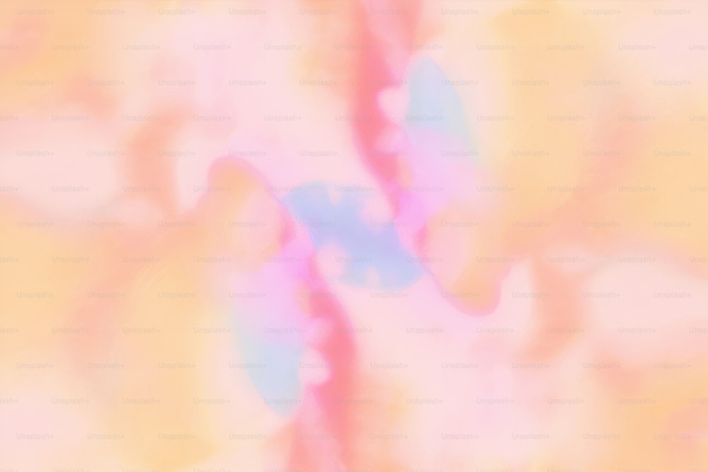 a blurry image of a pink, blue, and yellow background