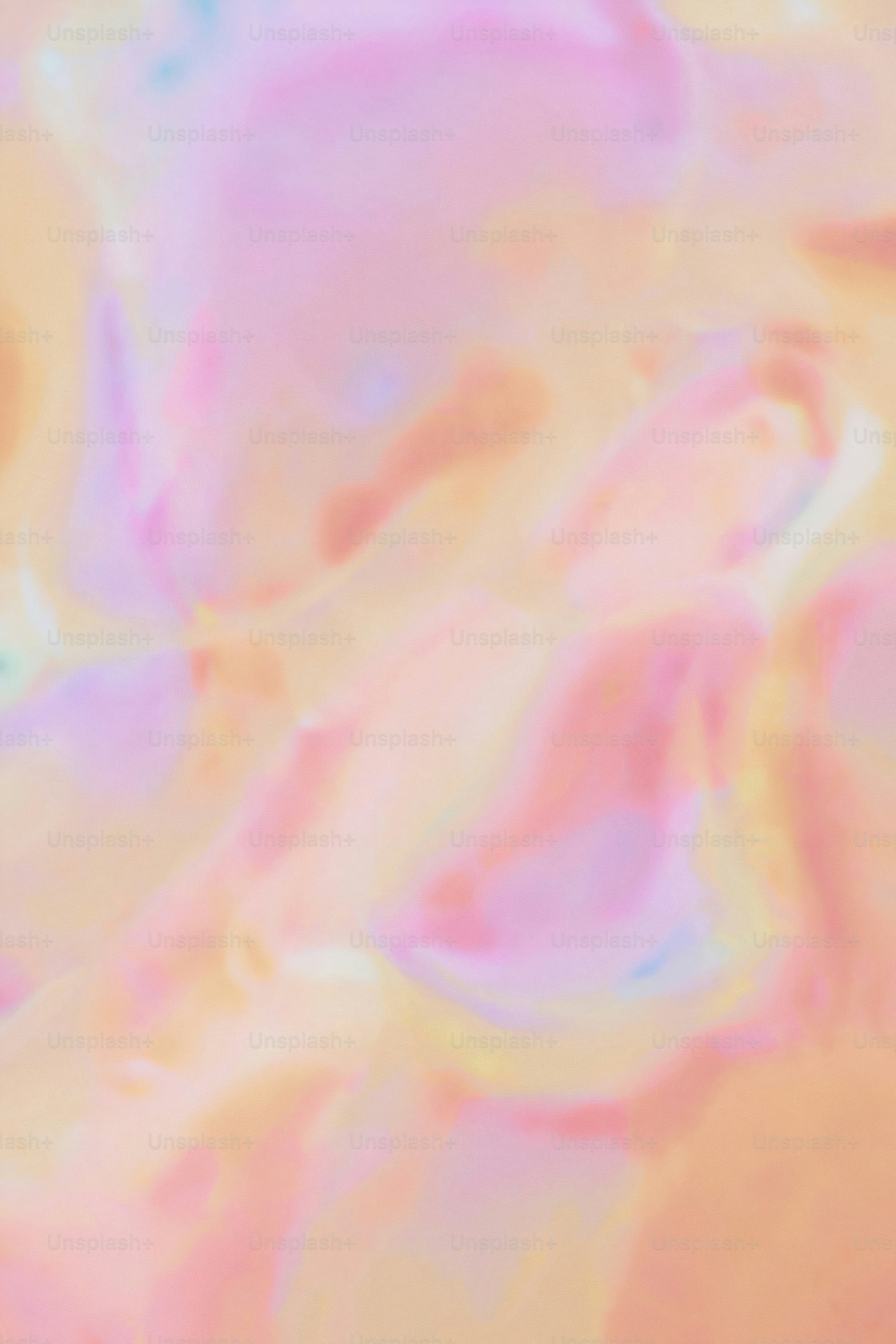 a close up of a pink and yellow liquid