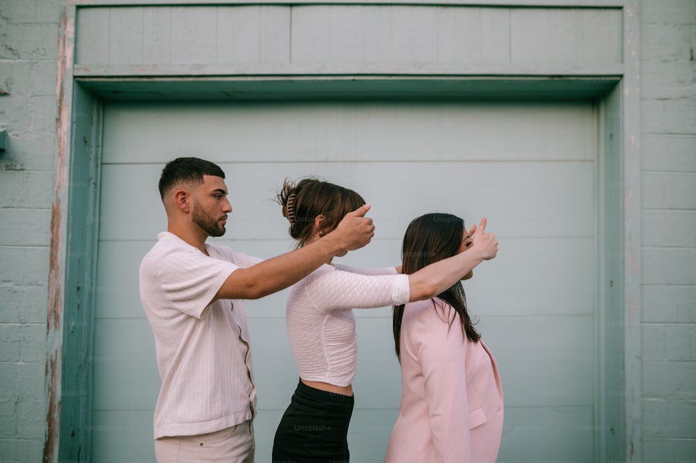 a couple of people that are standing in front of a door