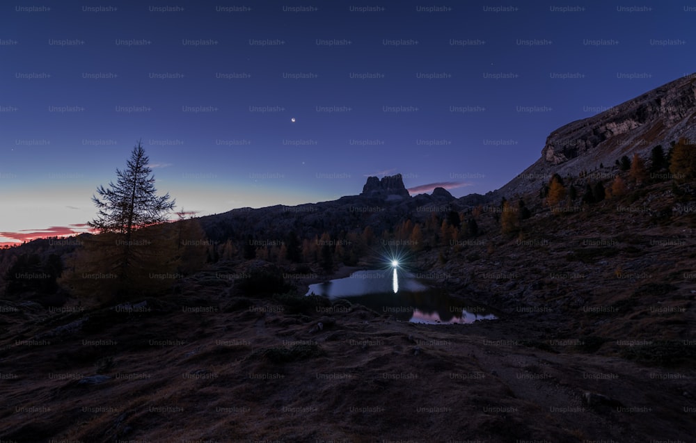 a small lake in the middle of a mountain