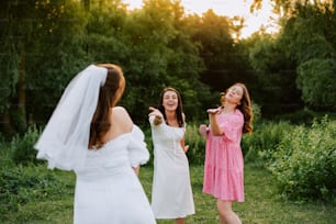 a bride and her bridesmaids are laughing together