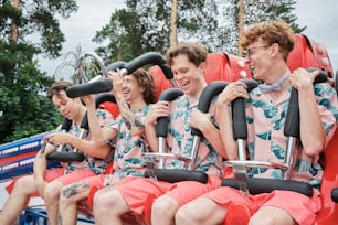 a group of people riding on top of a roller coaster