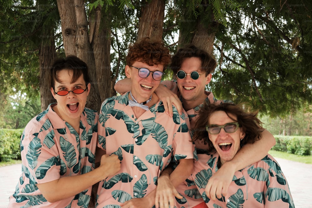 a group of men in matching pajamas posing for a picture