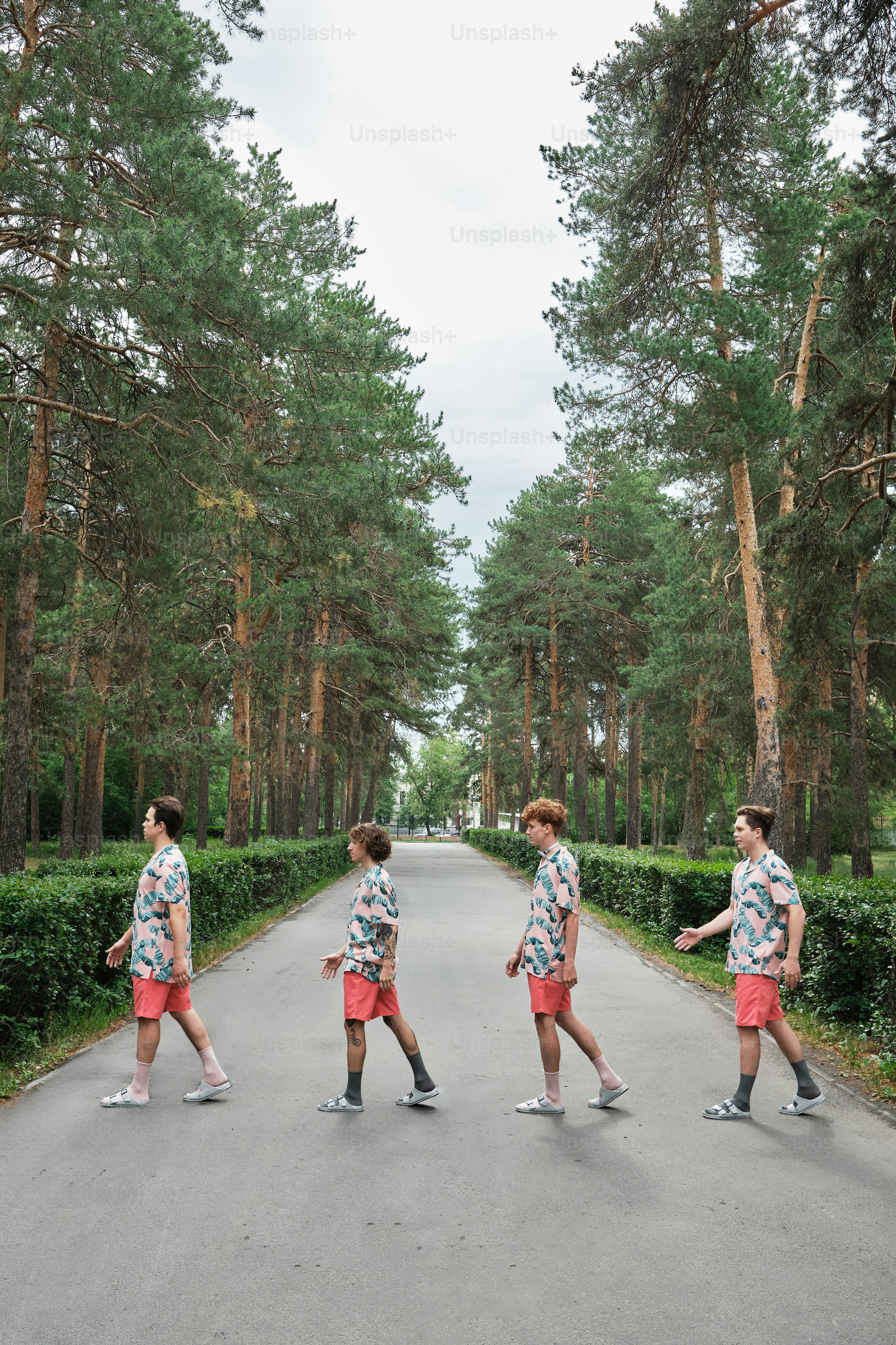 a group of young men walking down a road