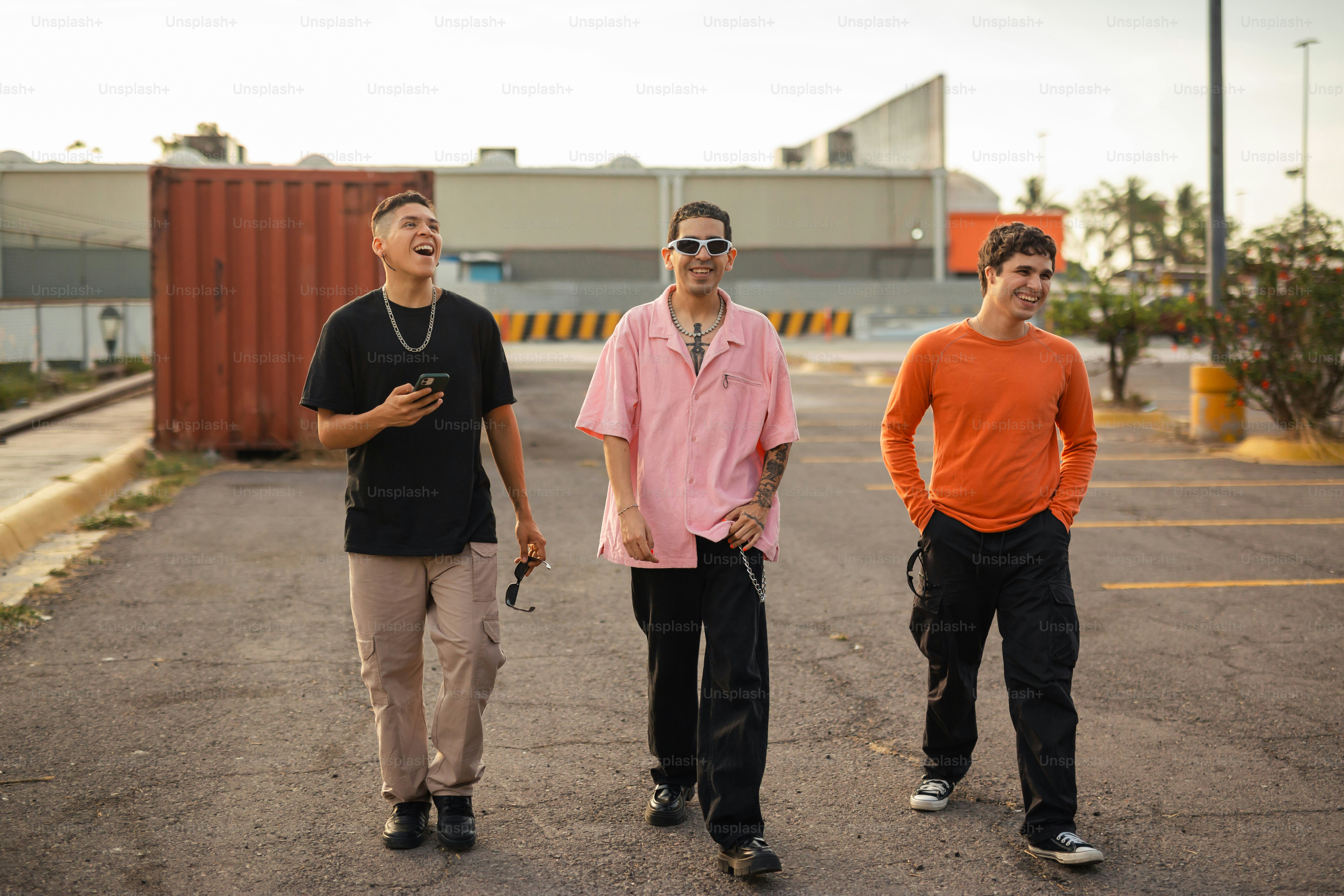 a group of three men standing next to each other