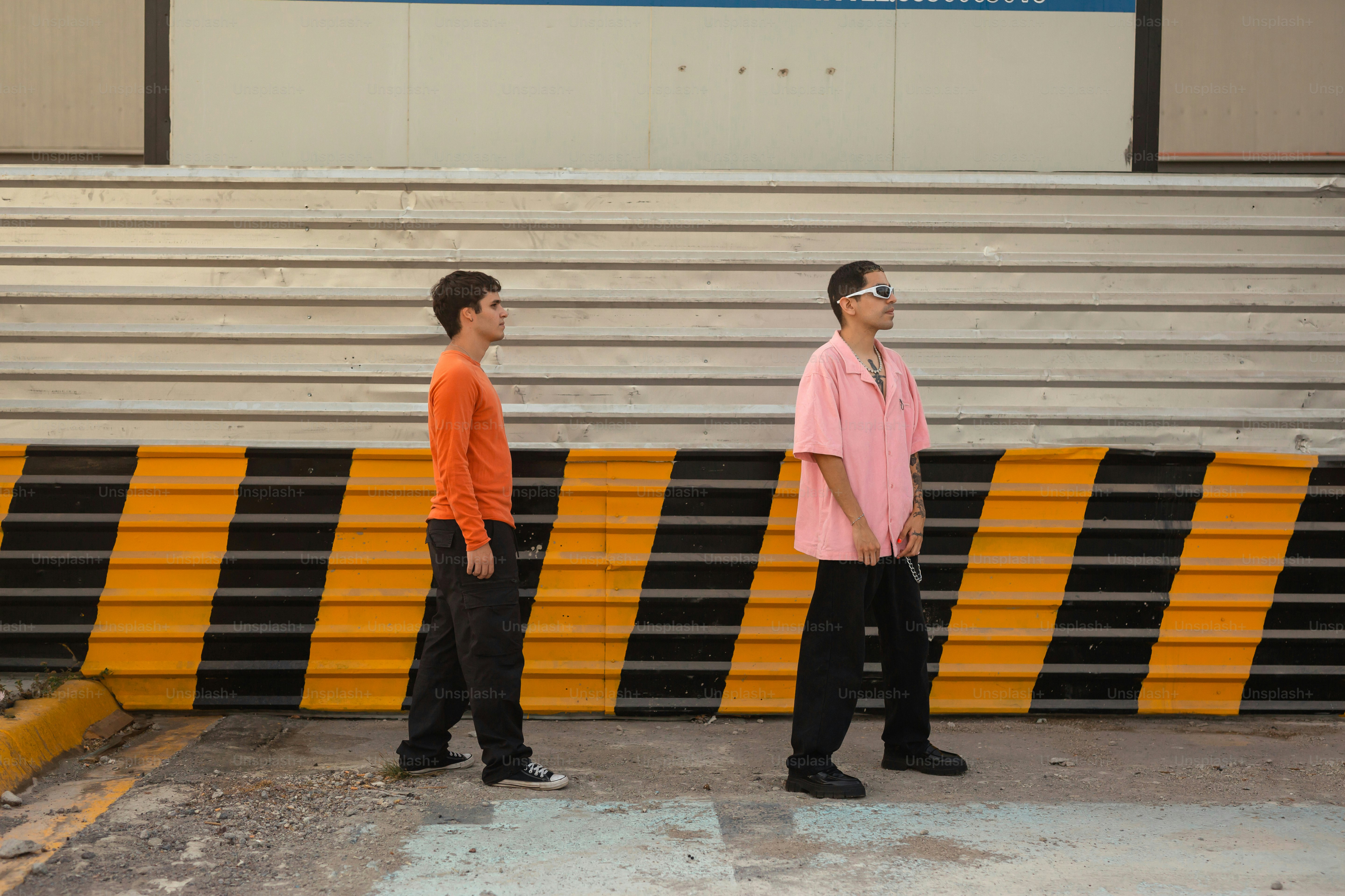 a couple of men standing next to each other