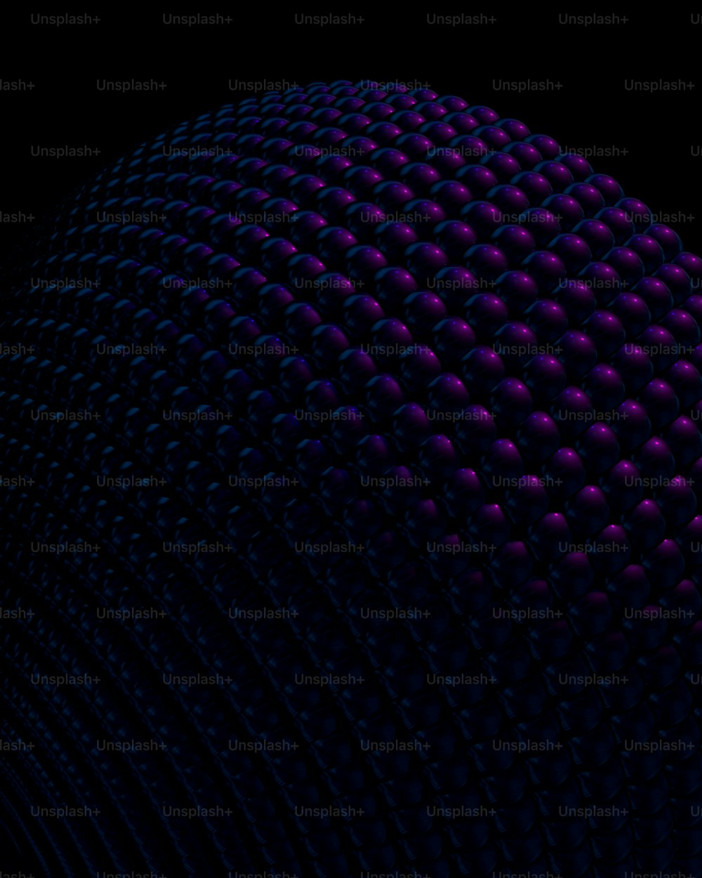 a large ball of purple balls in the middle of a black background