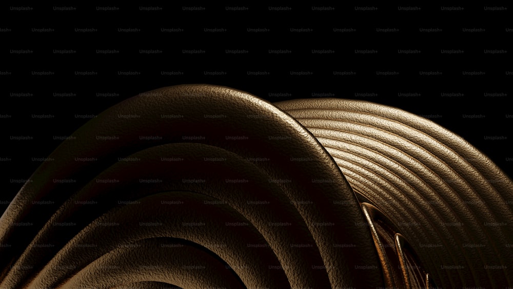 a close up of a black background with gold lines
