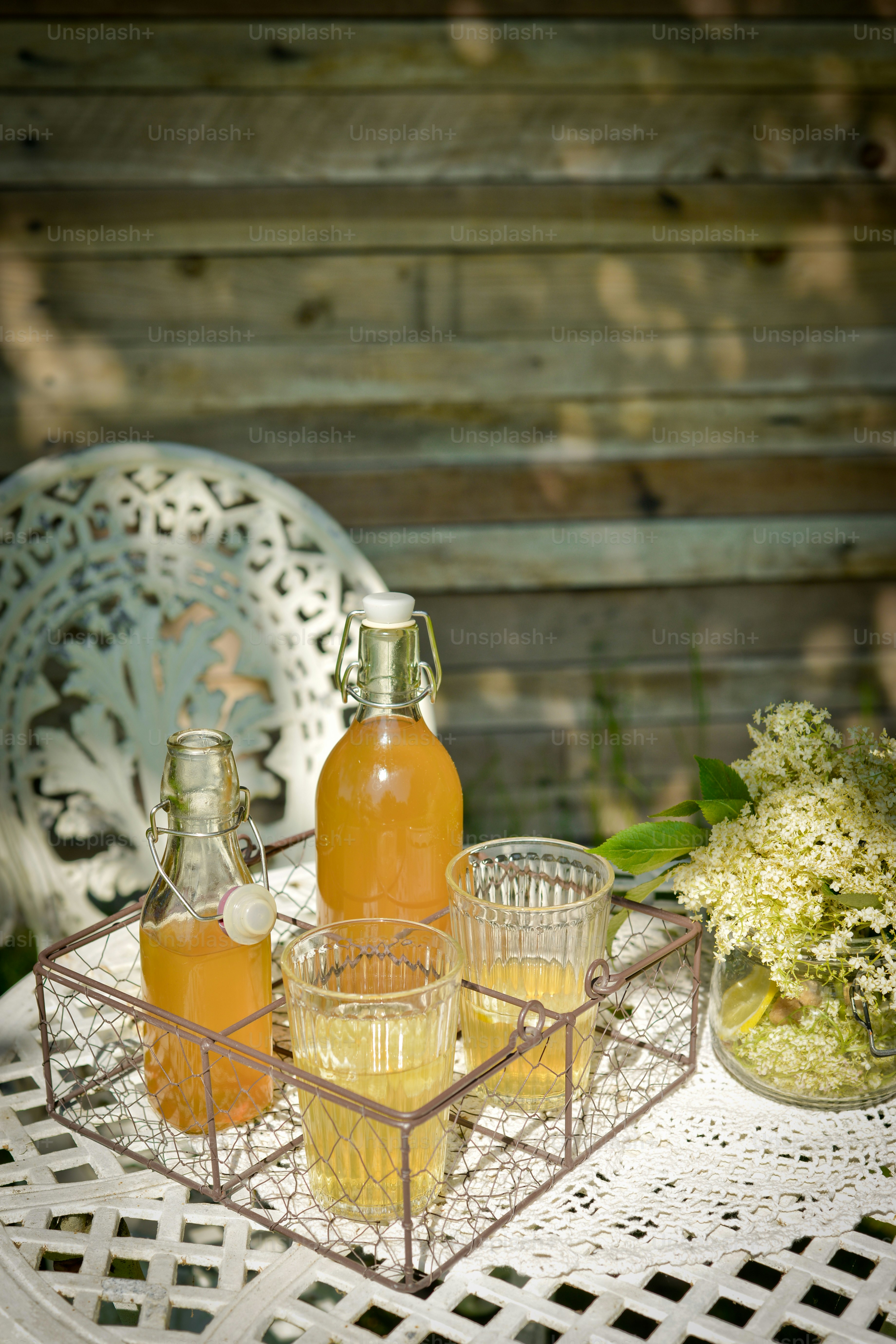 a tray with glasses and bottles on a table