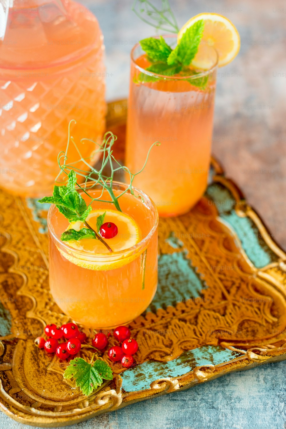 a tray with two glasses of drinks on it