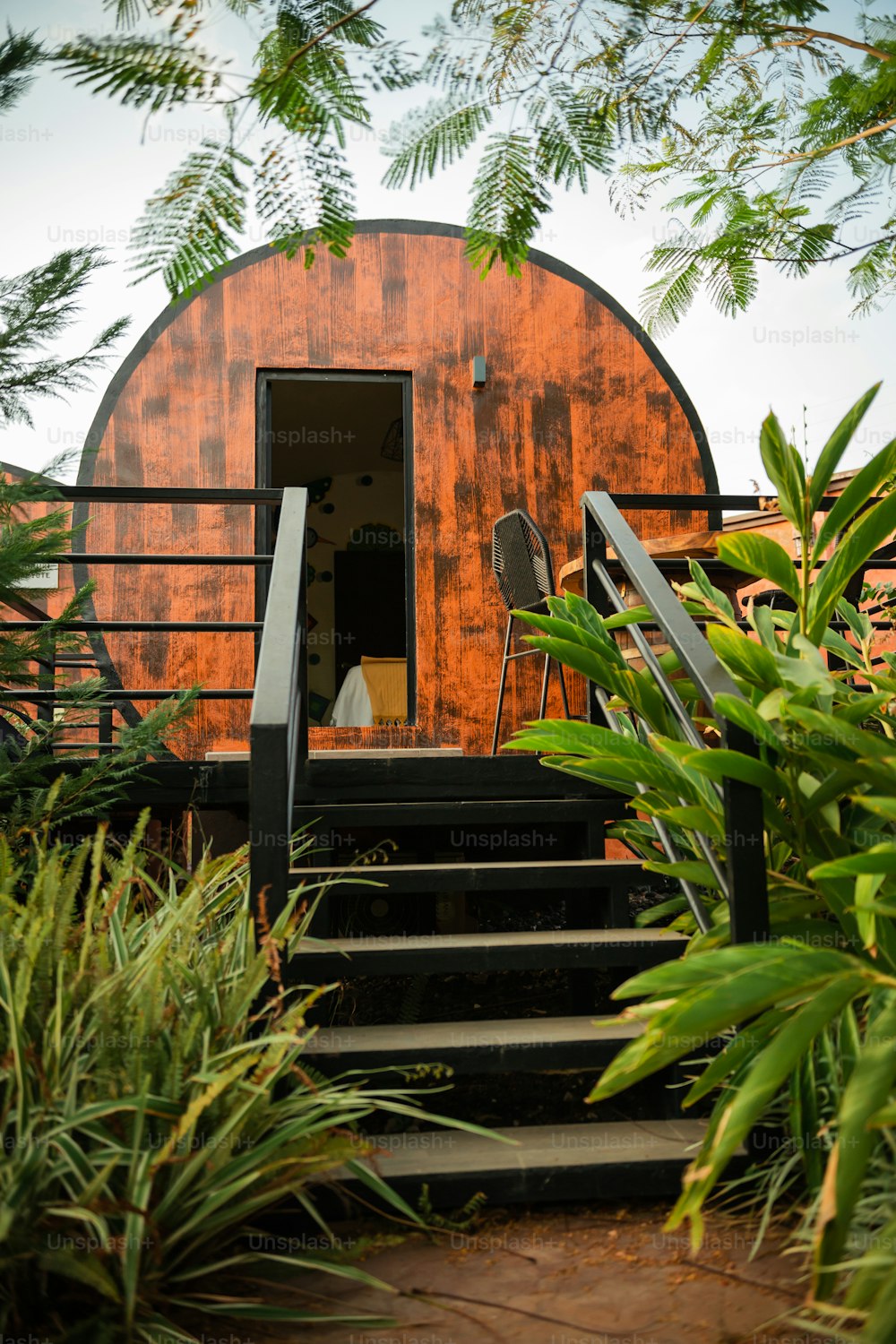 a wooden structure with stairs leading up to it