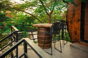 a wooden barrel sitting on top of a wooden table