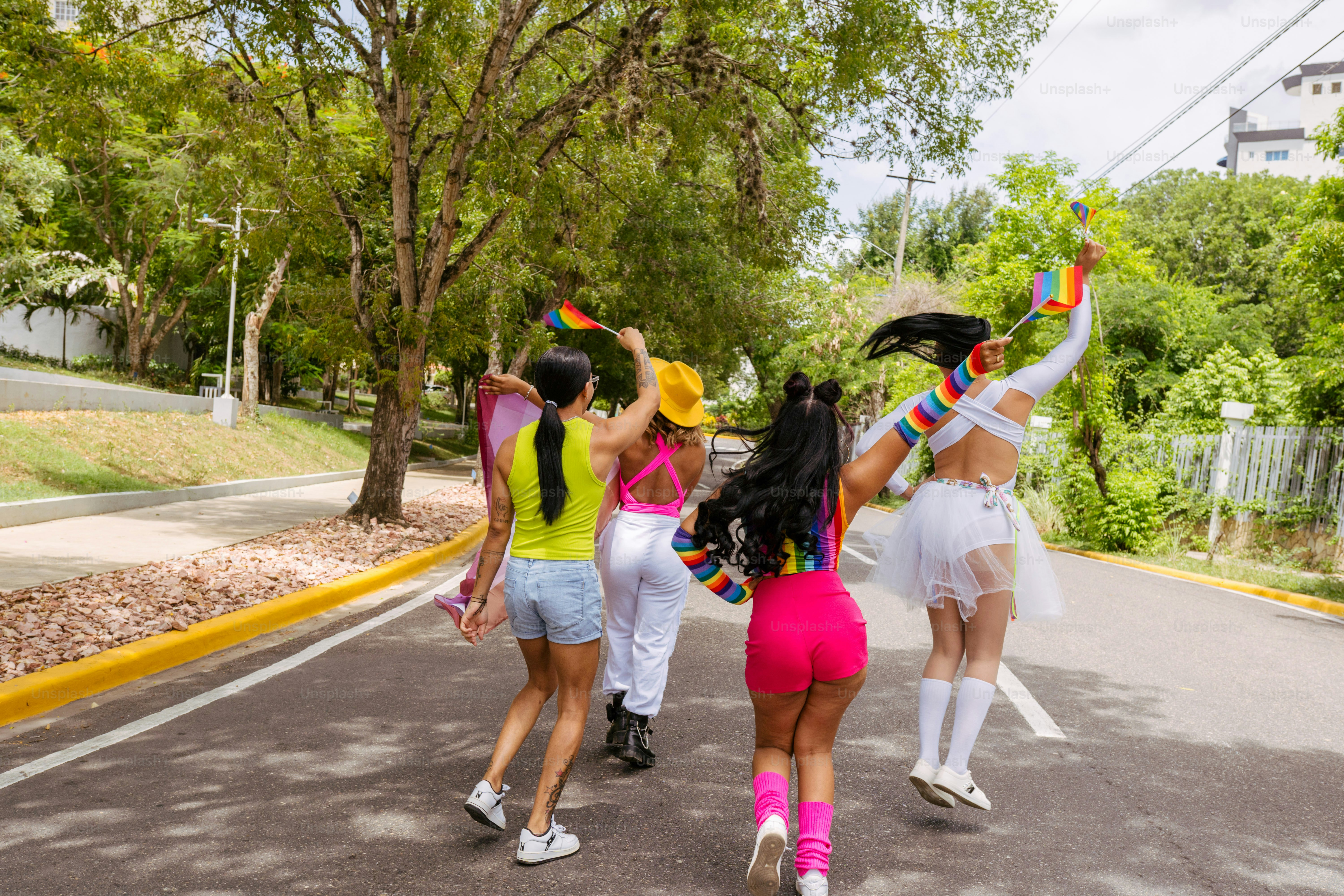 a group of young women walking down a street