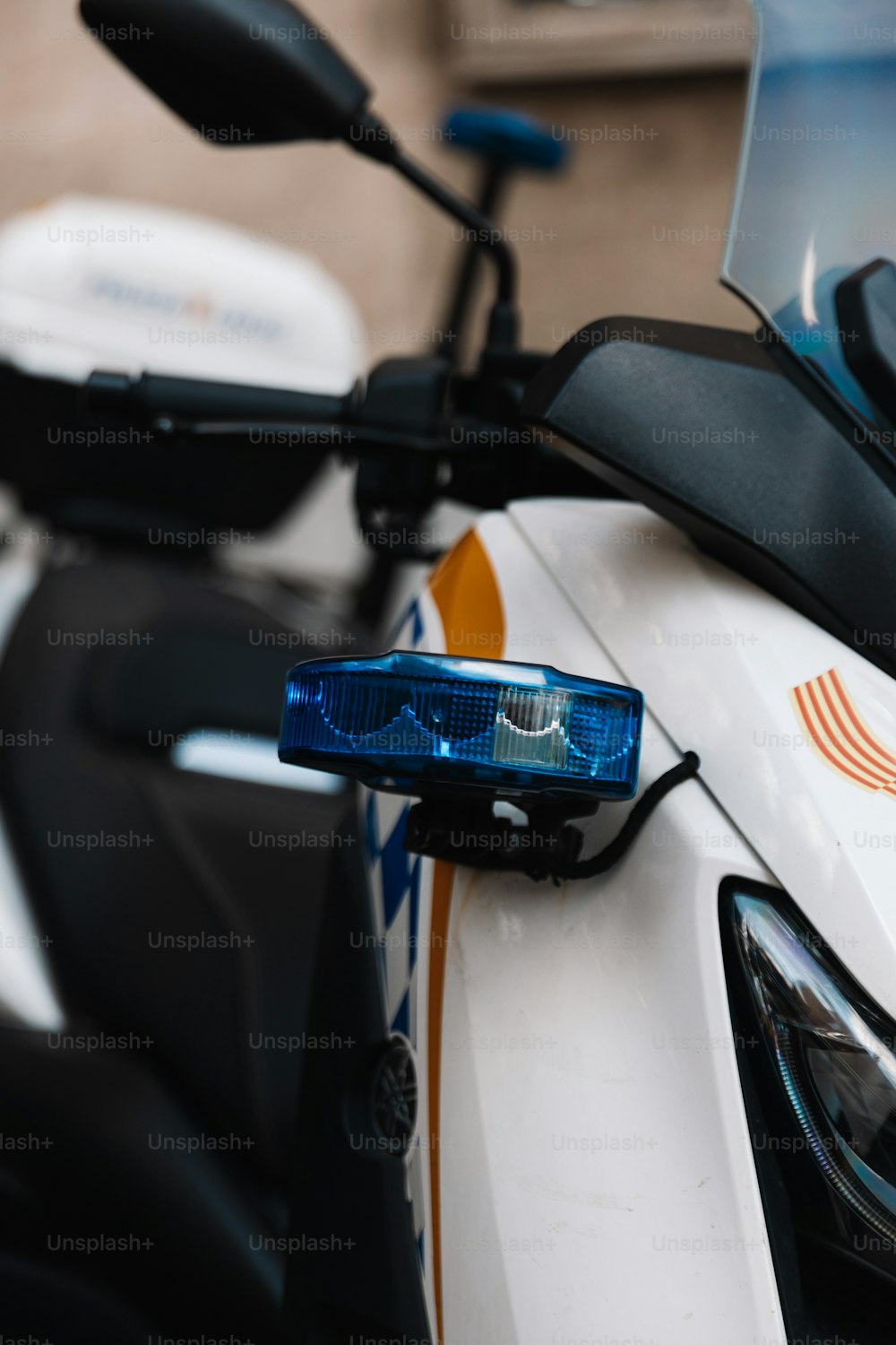 a close up of a motorcycle with a blue light on it