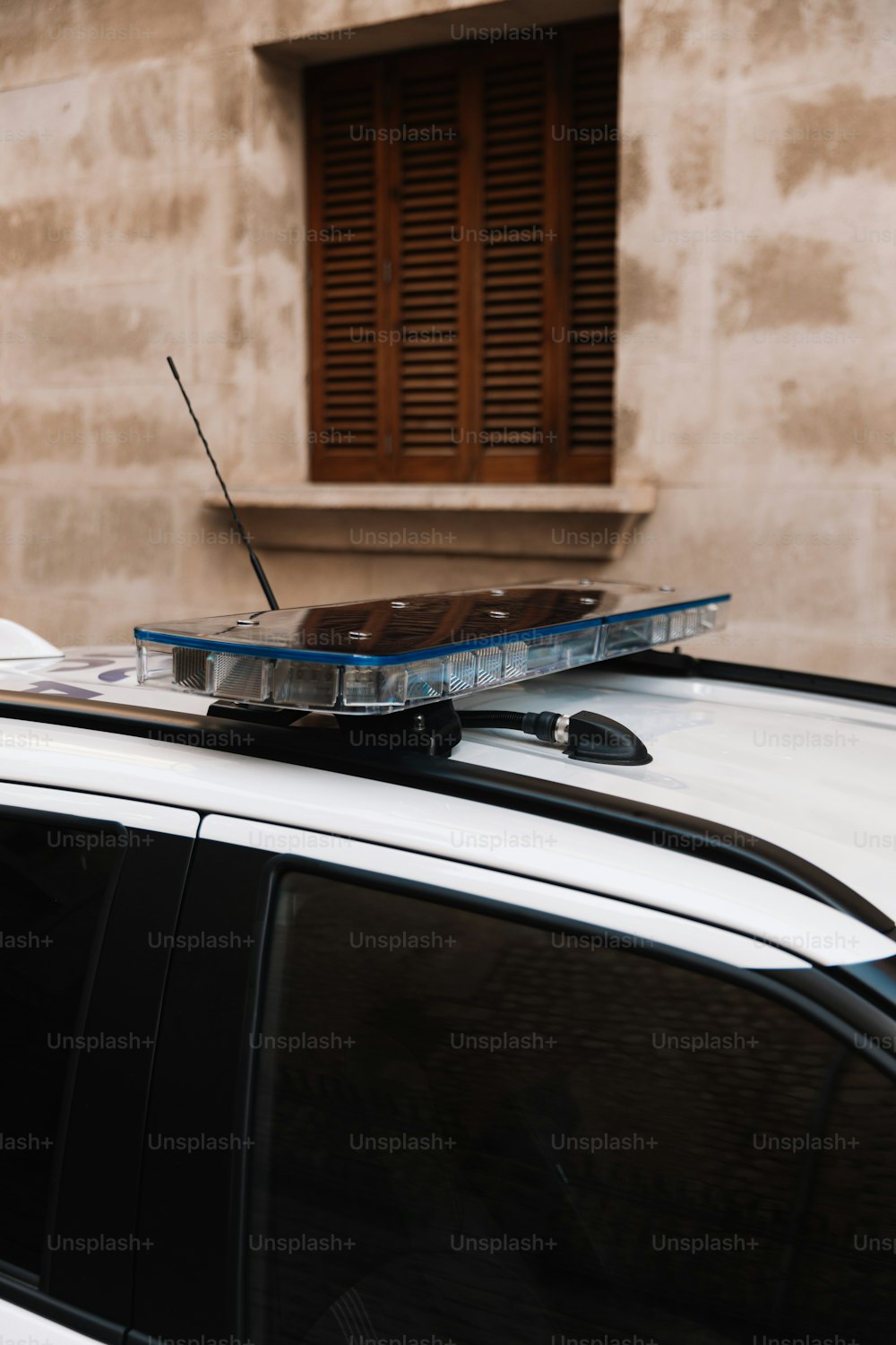 a police car parked in front of a building