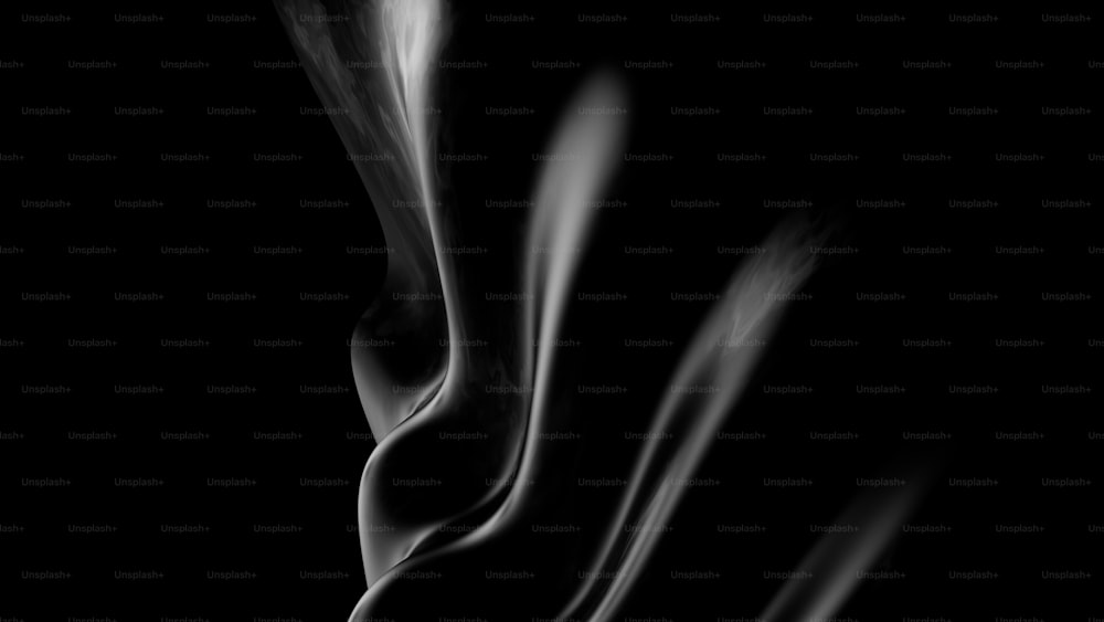 Une photo en noir et blanc de fumée