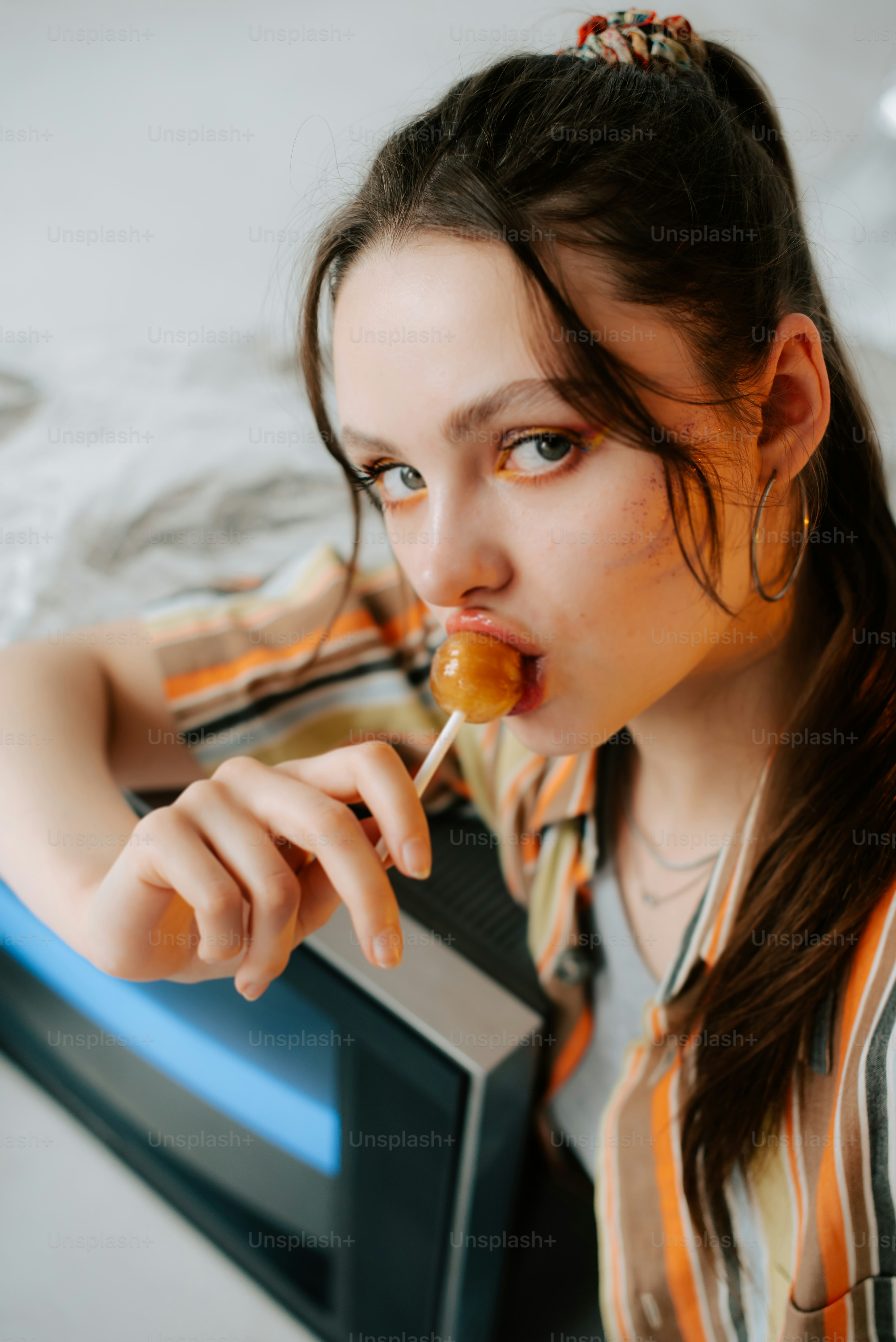 a woman with a toothbrush in her mouth