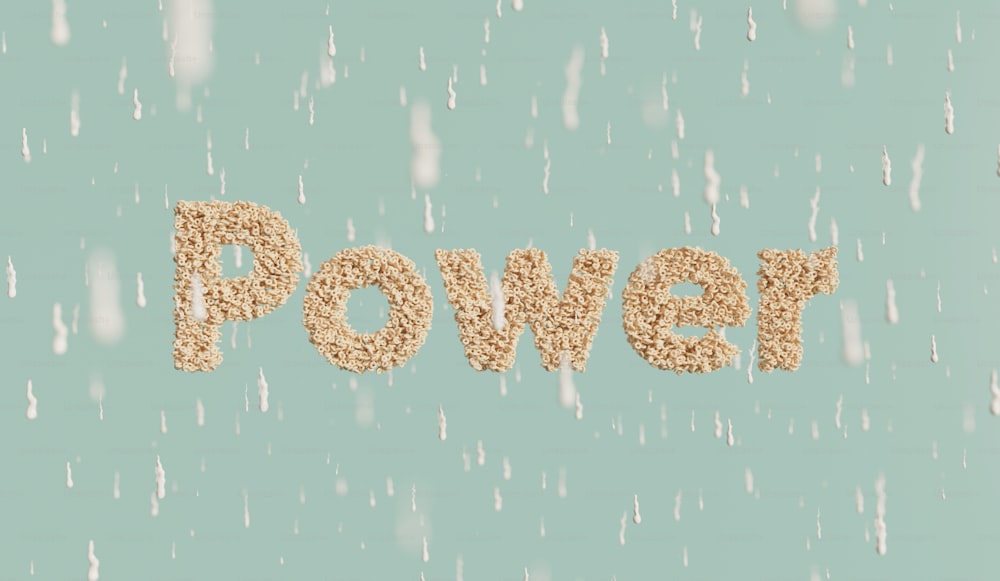 La parola potere scritta nella sabbia su uno sfondo blu