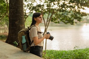 a woman with a backpack and a camera