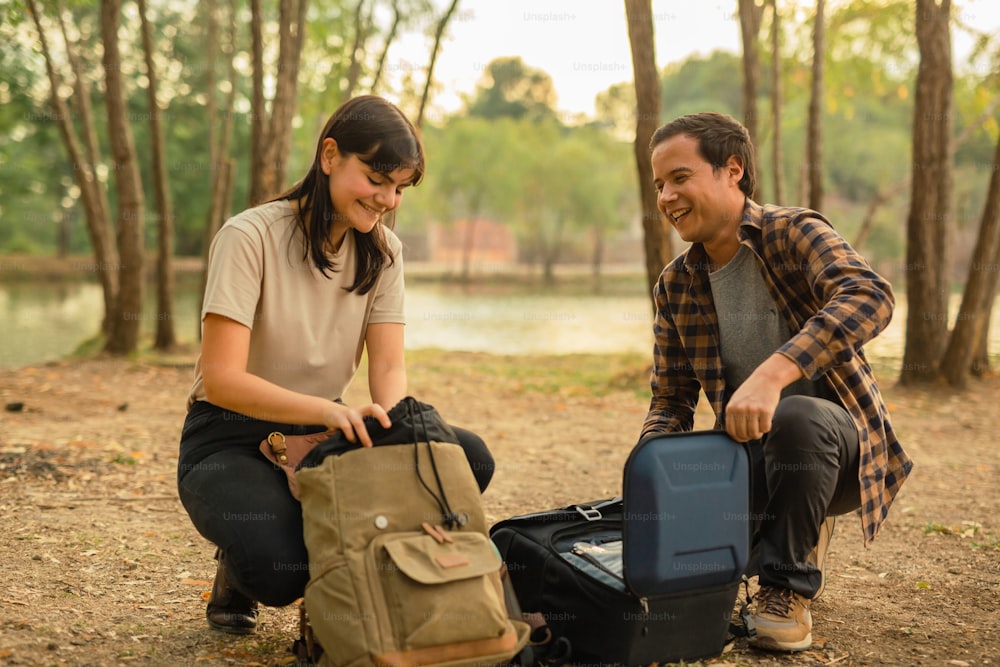 a man and a woman with their luggage