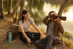 a man and a woman sitting next to each other