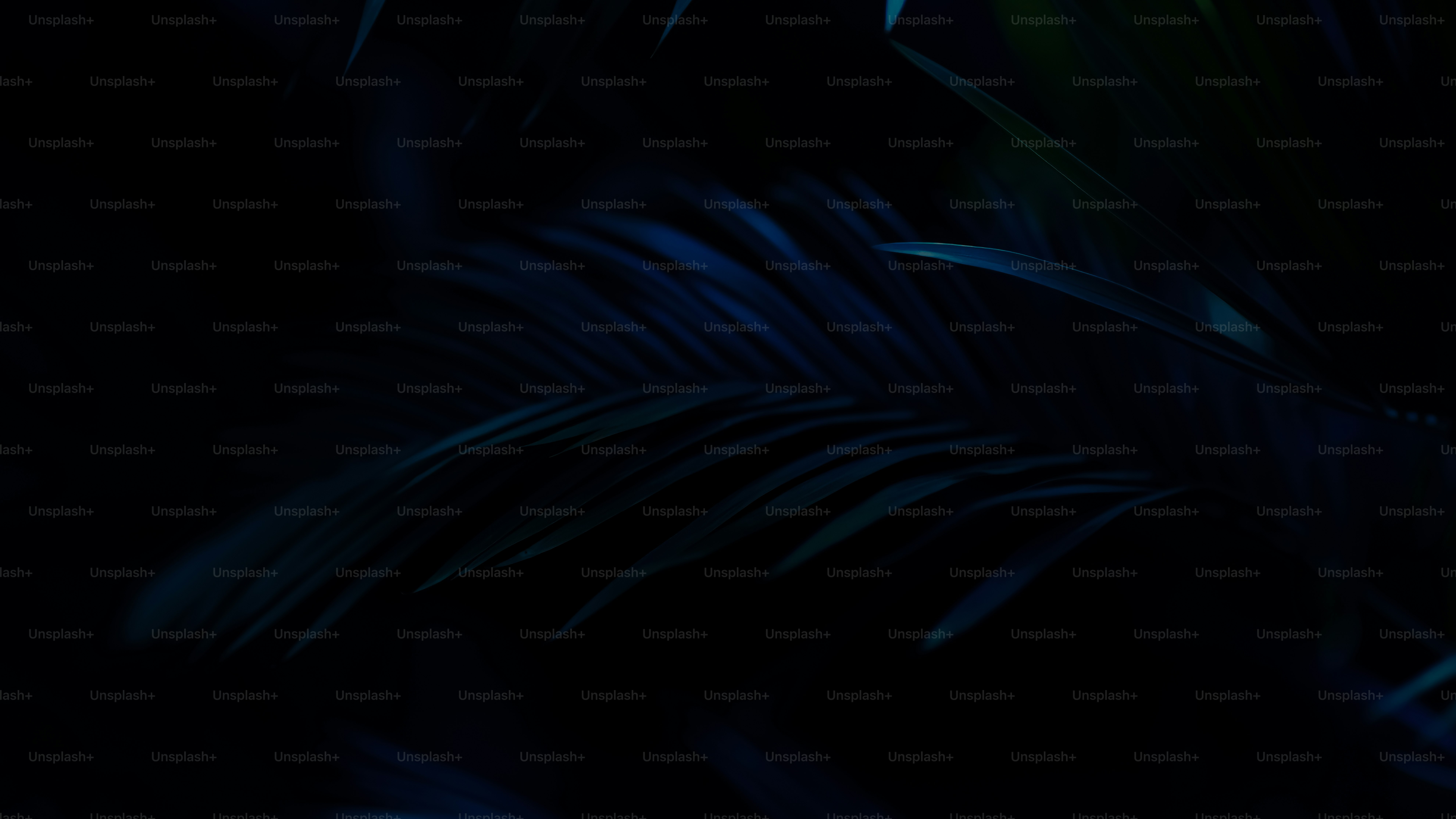 a black background with blue and green leaves