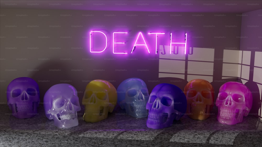 Une rangée de crânes de couleur néon dans une pièce