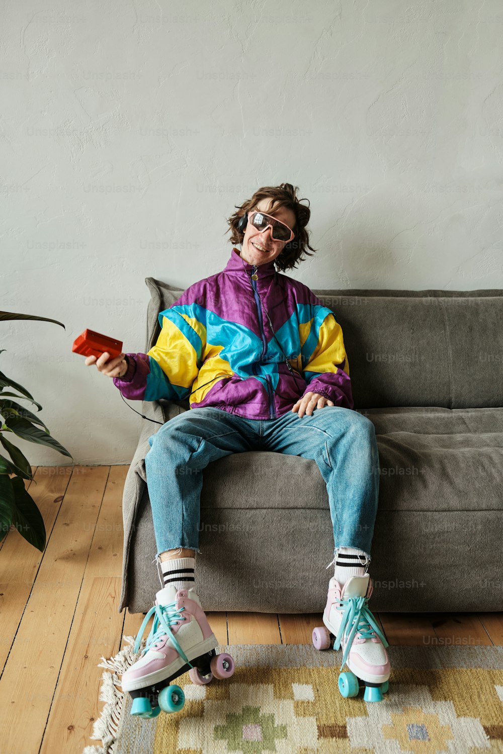 a person sitting on a couch with roller skates