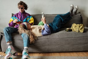 a man and a woman laying on a couch