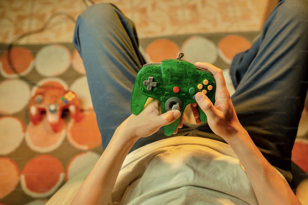 a person holding a game controller in their hands