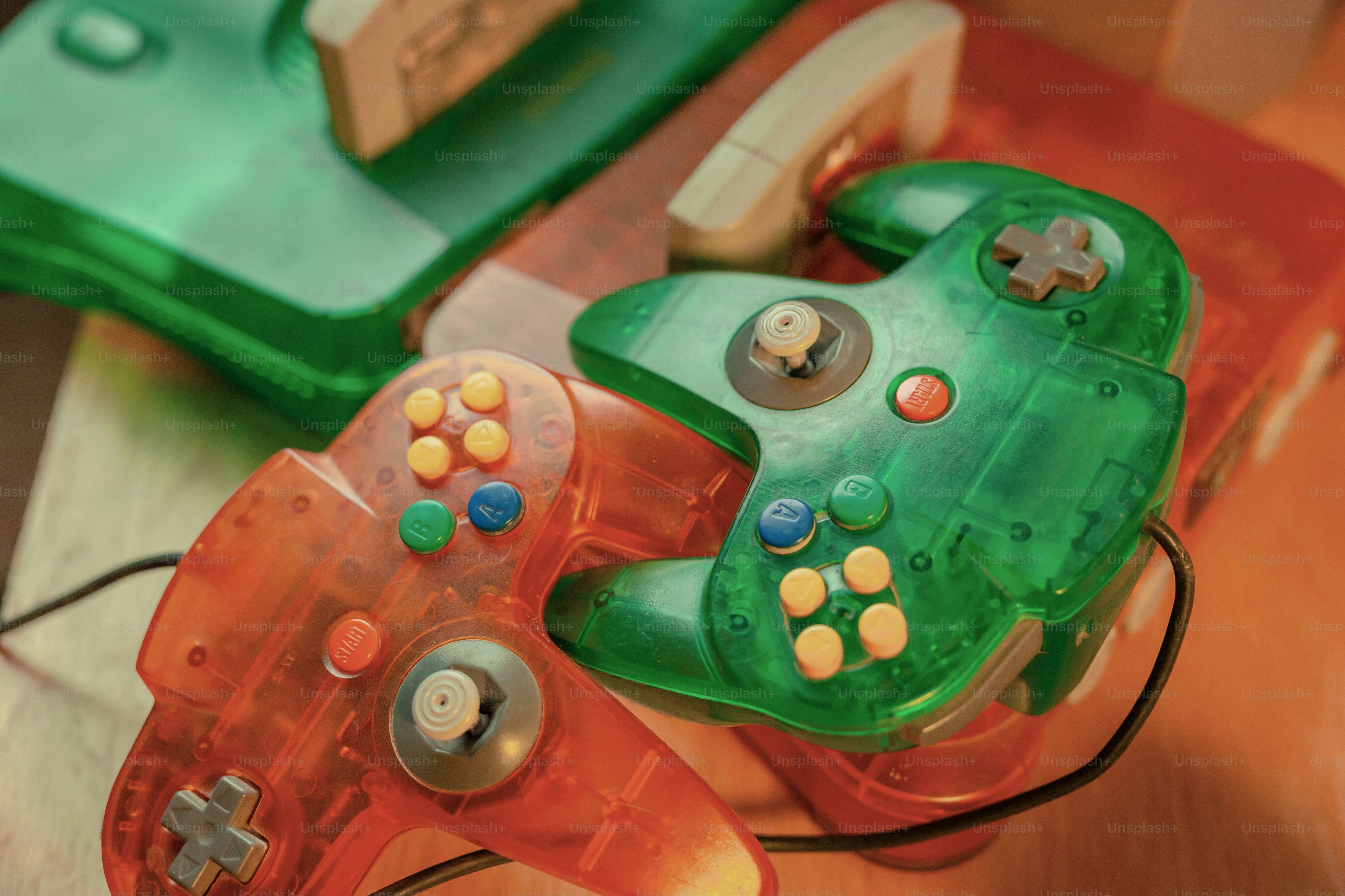 a couple of video game controllers sitting on top of a table