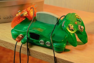 a video game controller sitting on top of a wooden table