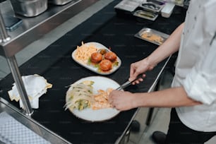 a person cutting up food on a plate