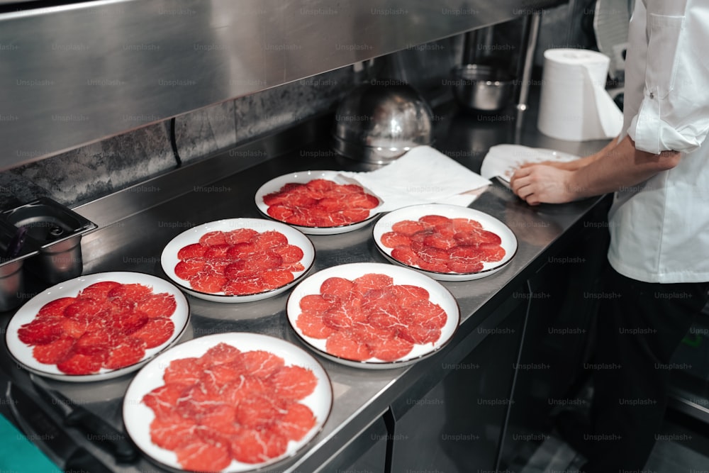 a person in a kitchen preparing food on a stove