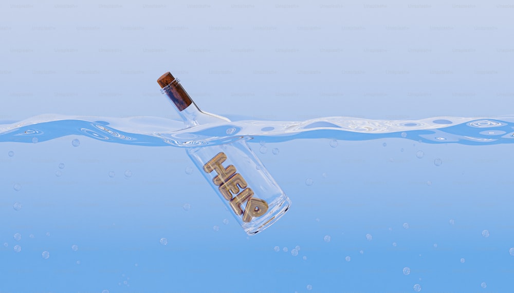 a bottle floating in the water with a toothbrush sticking out of it